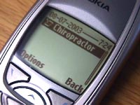 Photograph of cell phone showing Chiropractor appointment and Back button