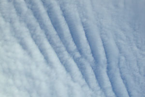 Wind streaked clouds zoomed